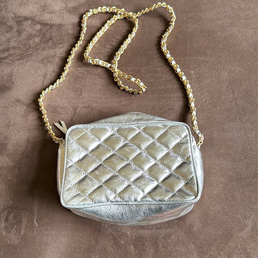 Silver Papagallo quilted purse with gold embellishment chain
